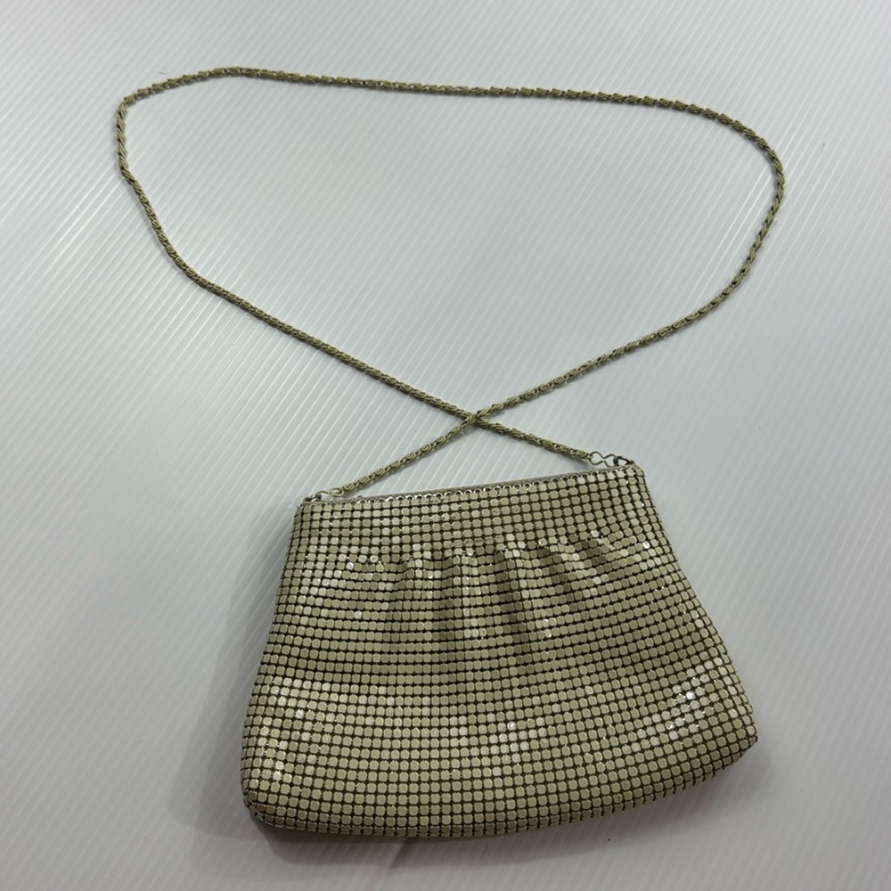 59. Shimmering super cute white purse